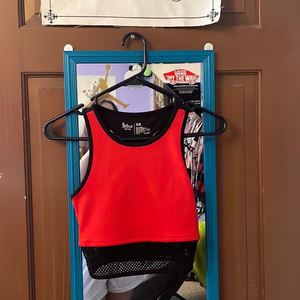 Red sleeveless crop top with fishnet